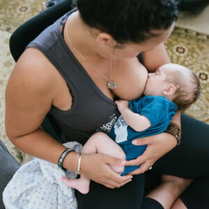 white mother breastfeeding infant