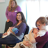 white women holding infants
